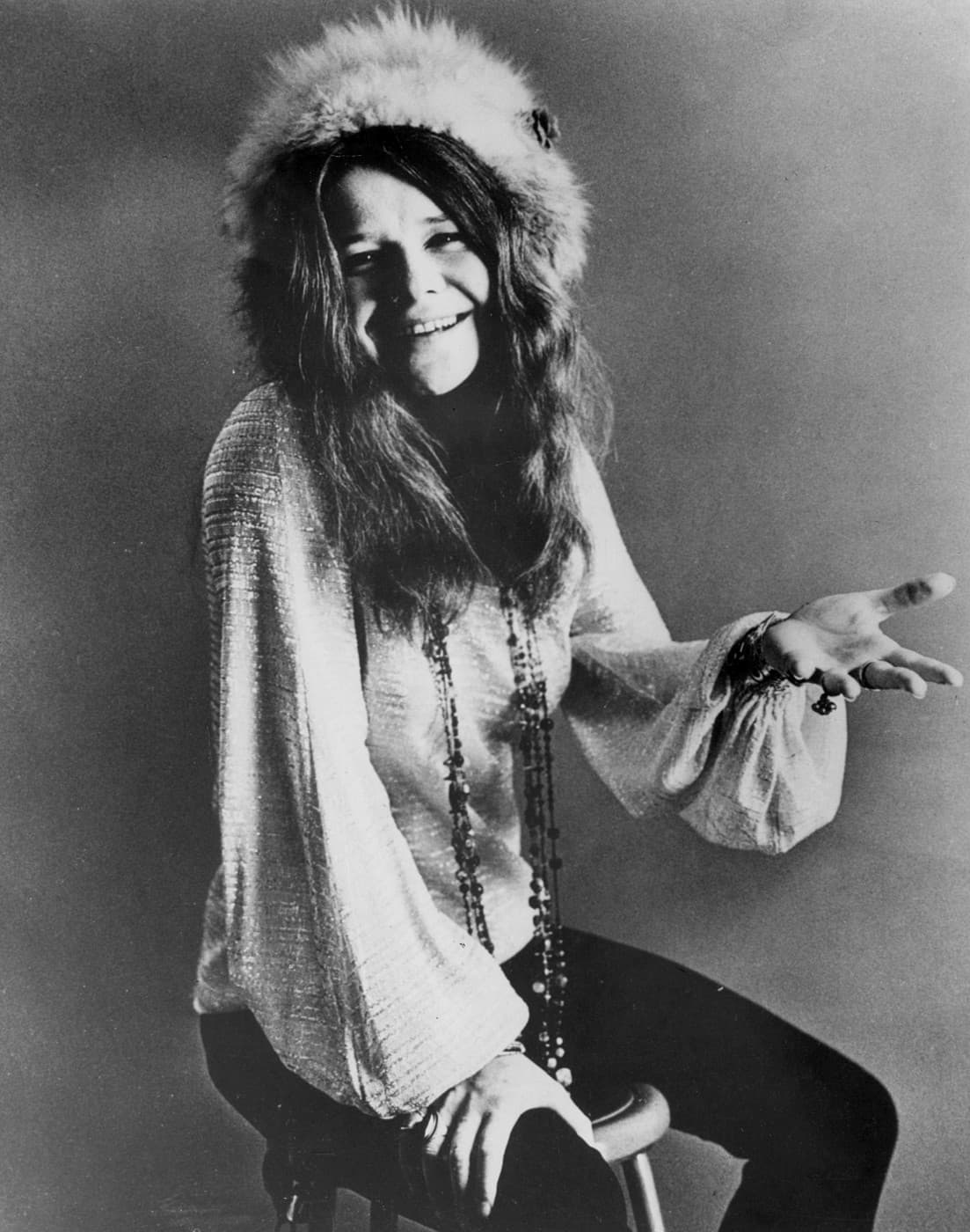 Janis Joplin, seated publicity portrait (c. 1969–1970), public domain in the United States